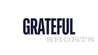 grateful shorts logo on a white background